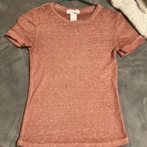 Blush pink shirt, 54% cotton, 46% polyester, size XS but can go up to a size S.